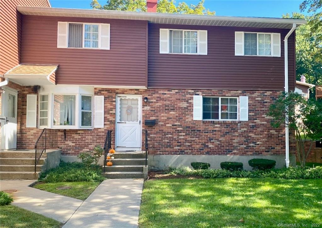 58 Patricia Road, Unit A Bridgeport, CT 06606 - Photo 1 of 1 a brick building with a yard