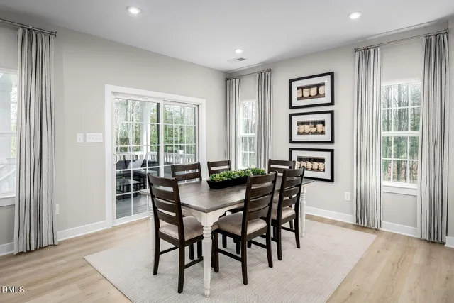 a living room with furniture white walls and white walls