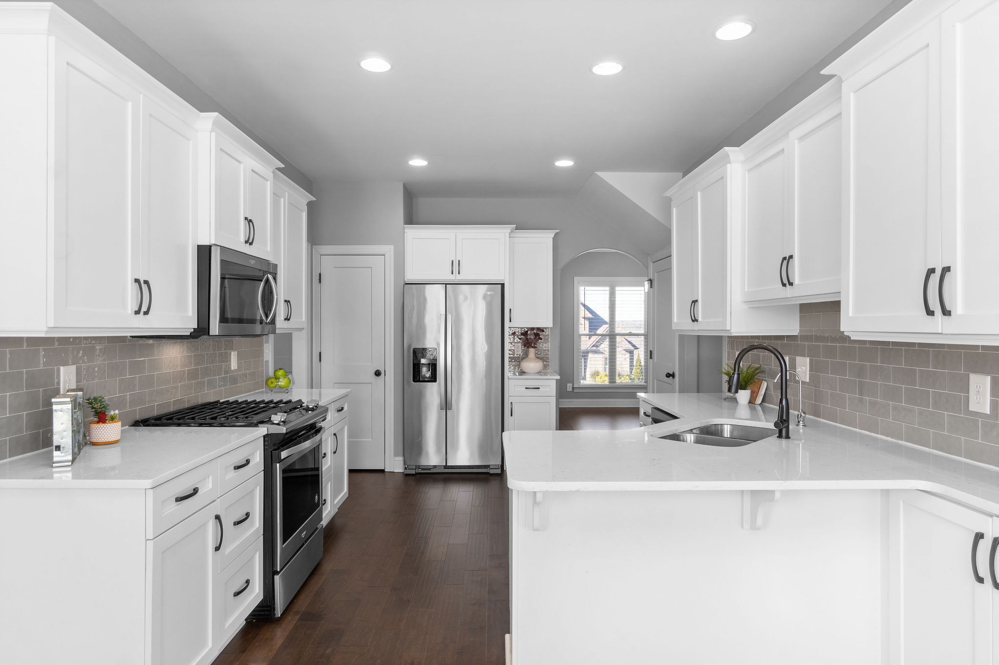 520 Larkspur Drive Clarksville, TN 37043 - Photo 11 of 34 a kitchen with stainless steel appliances a sink a stove a refrigerator cabinets and a counter top space