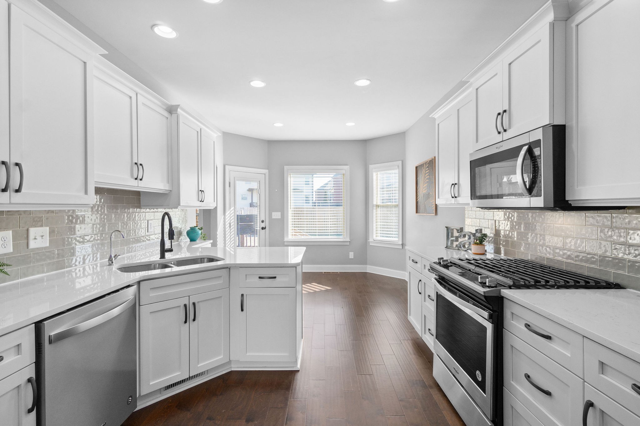 520 Larkspur Drive Clarksville, TN 37043 - Photo 12 of 34 a kitchen with stainless steel appliances granite countertop white cabinets a sink a stove a refrigerator and white cabinets