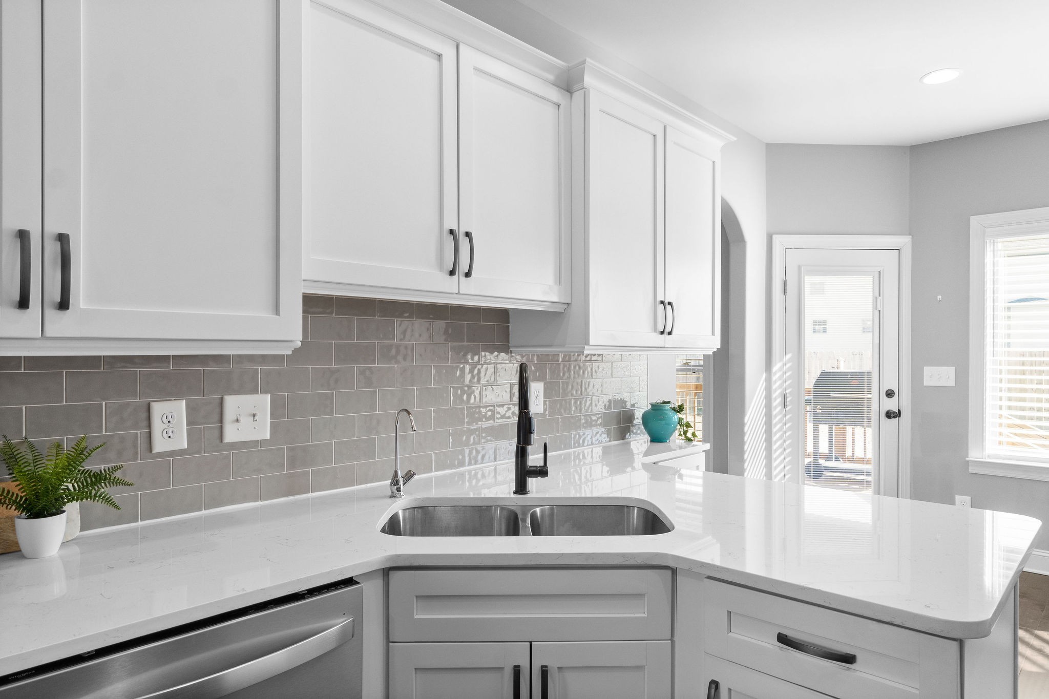 520 Larkspur Drive Clarksville, TN 37043 - Photo 13 of 34 a kitchen with stainless steel appliances white cabinets and a potted plant