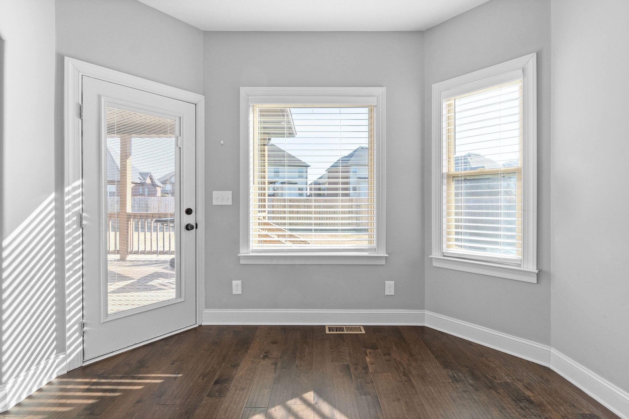 520 Larkspur Drive Clarksville, TN 37043 - Photo 15 of 34 an empty room with wooden floor and windows
