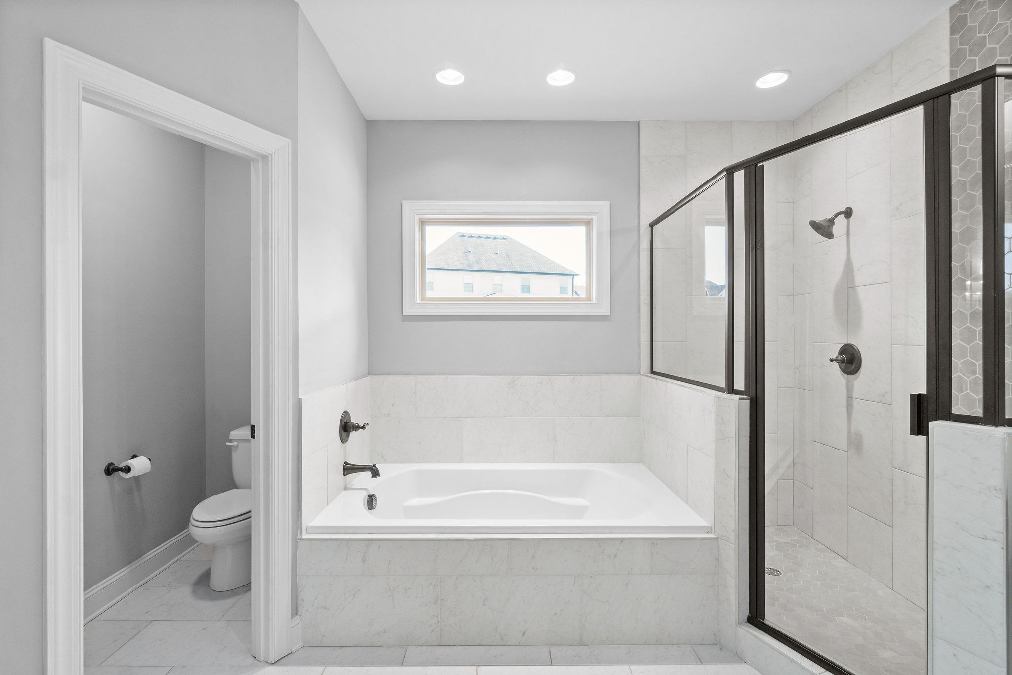 520 Larkspur Drive Clarksville, TN 37043 - Photo 19 of 34 a white bath tub sitting next to a toilet