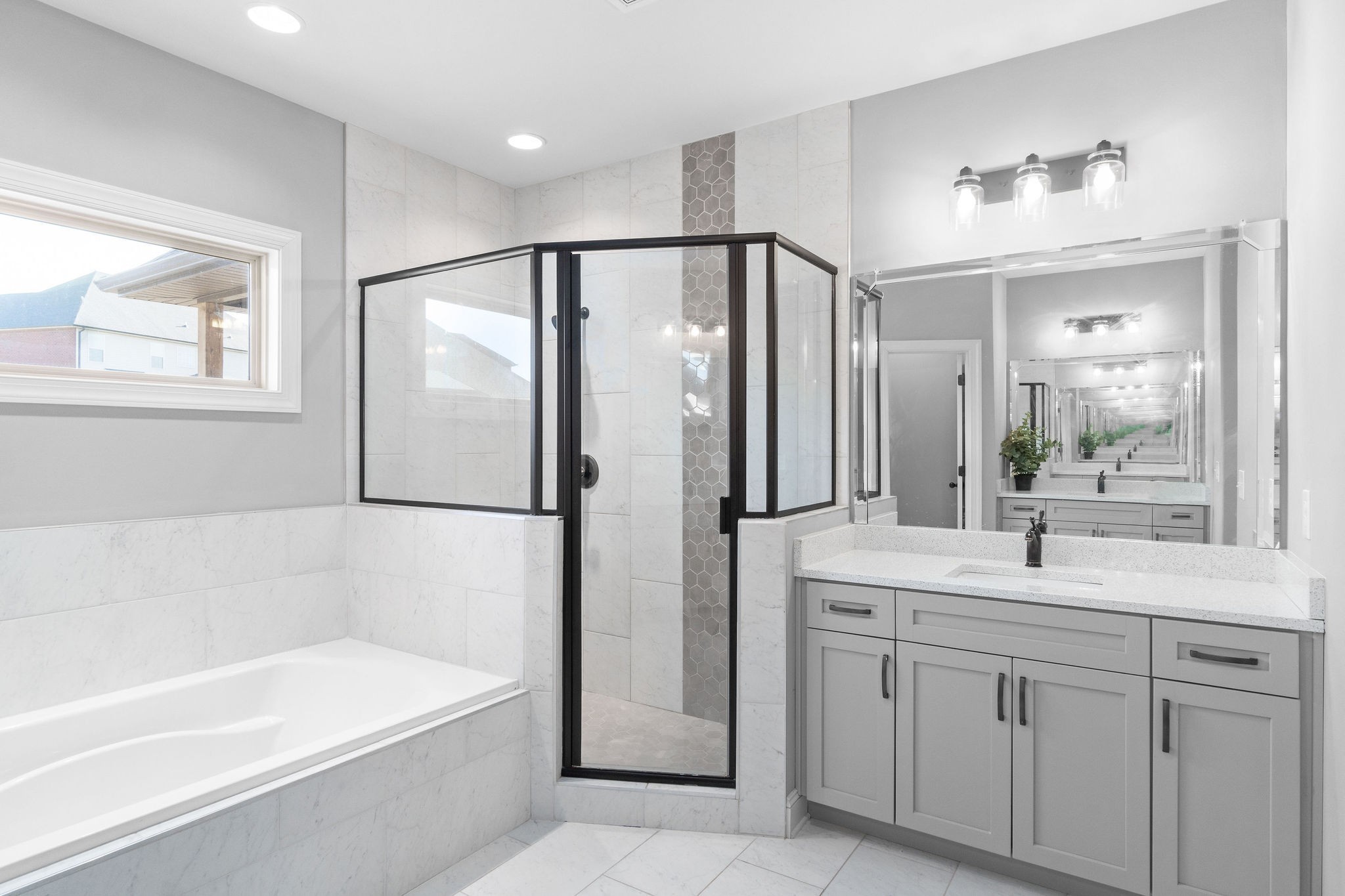 520 Larkspur Drive Clarksville, TN 37043 - Photo 21 of 34 a bathroom with a double vanity sink mirror and bathtub