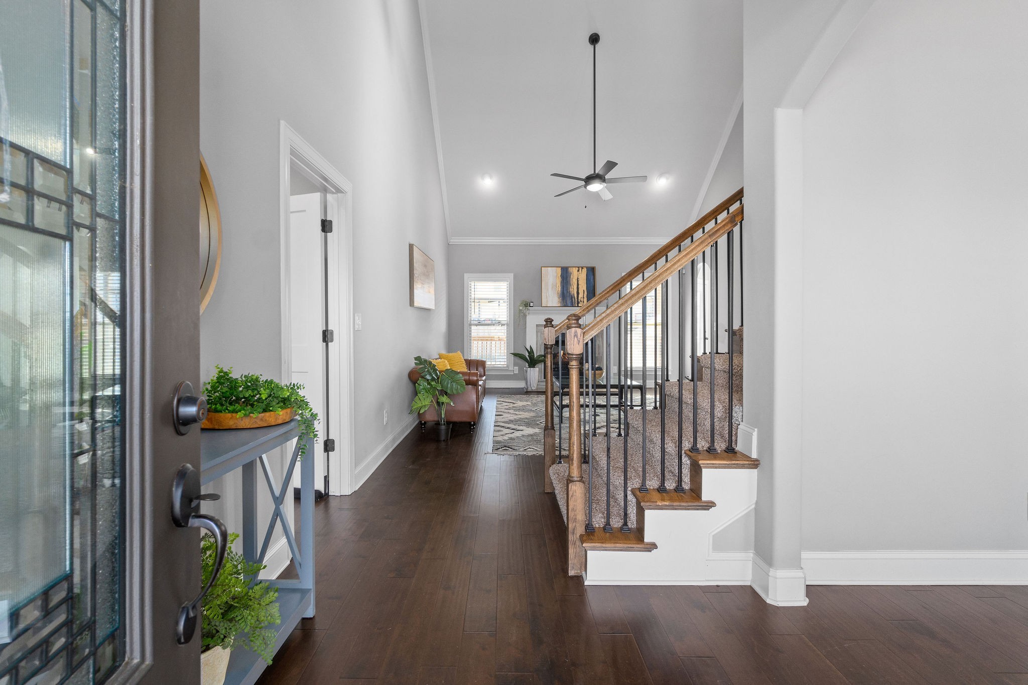 520 Larkspur Drive Clarksville, TN 37043 - Photo 3 of 34 a hallway with a chandelier and stairs