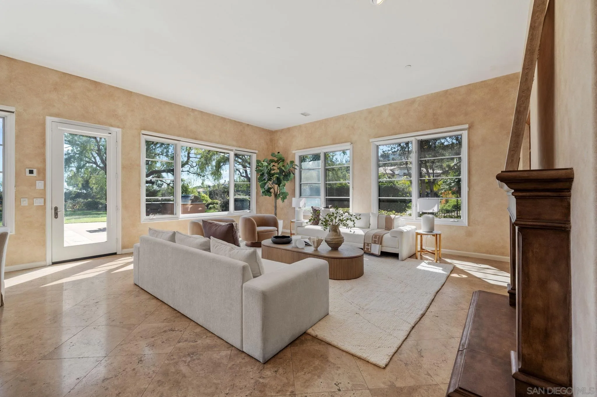 17813 La Amapola Rancho Santa Fe, CA 92067 - Photo 7 of 30 a living room with furniture and large windows
