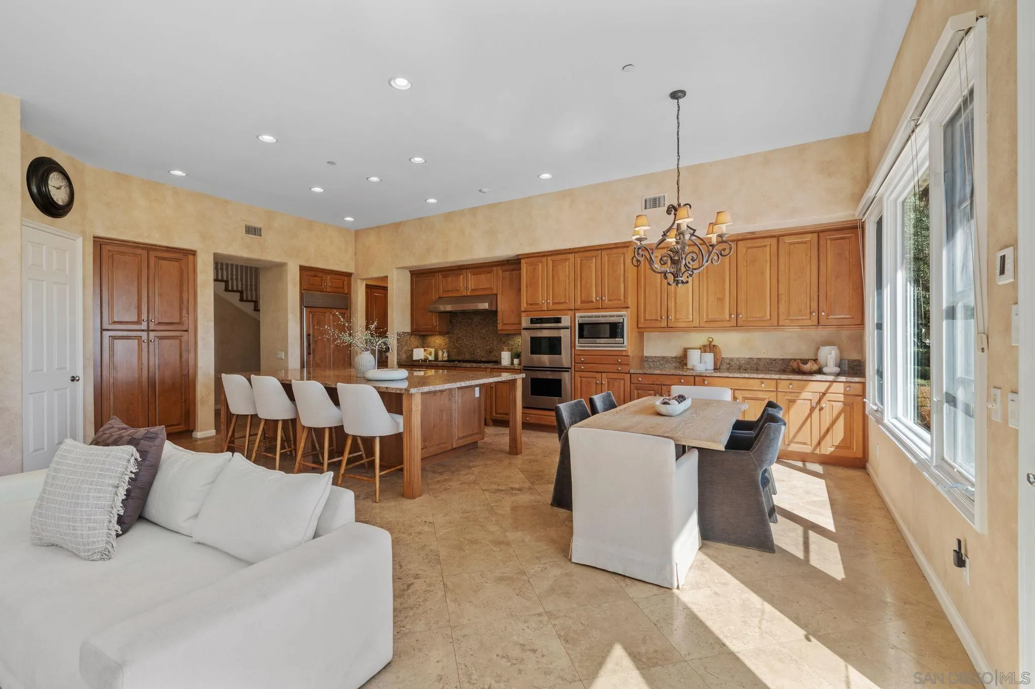 17813 La Amapola Rancho Santa Fe, CA 92067 - Photo 9 of 30 a living room with lots of furniture and kitchen view
