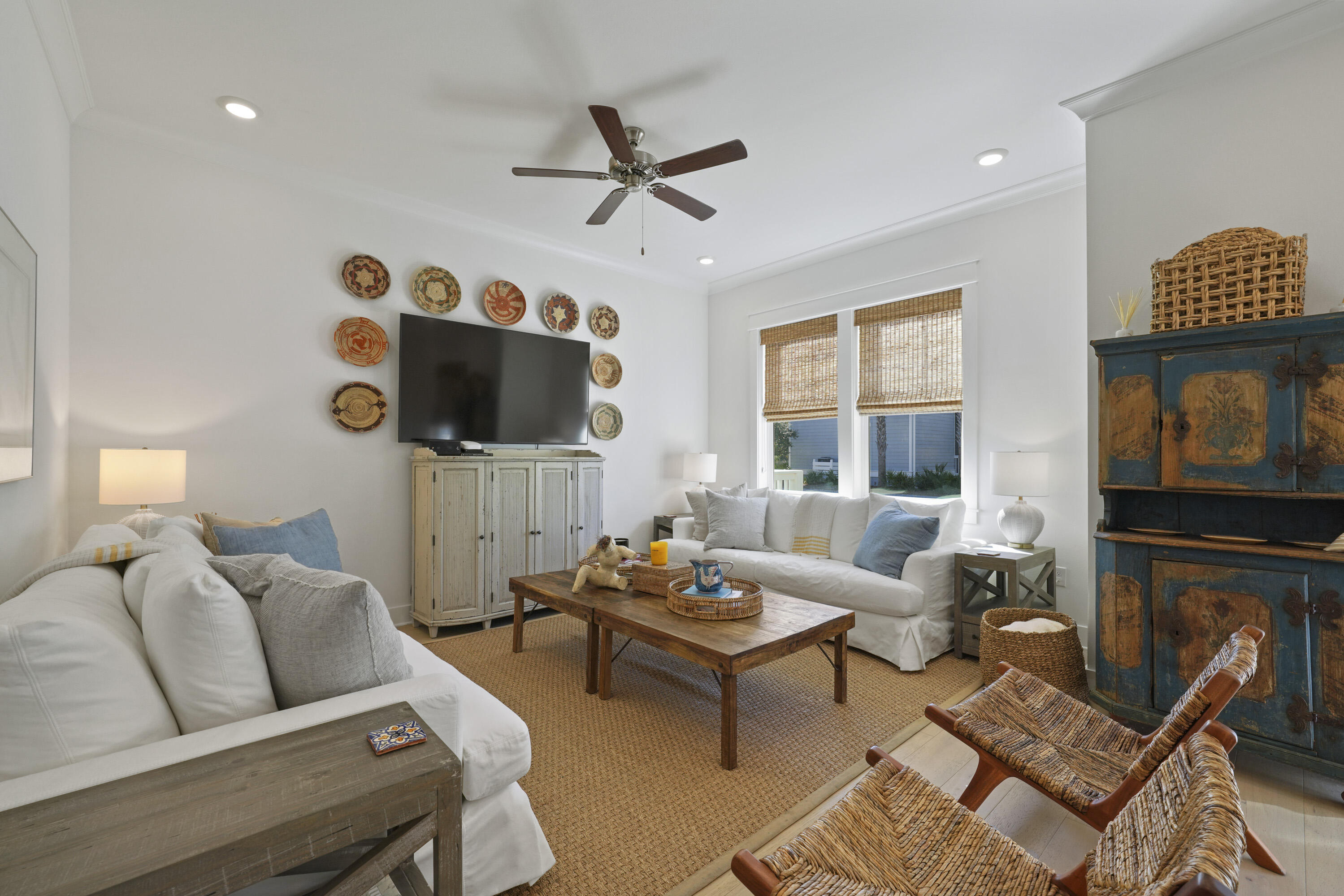 a living room with fireplace furniture and a flat screen tv