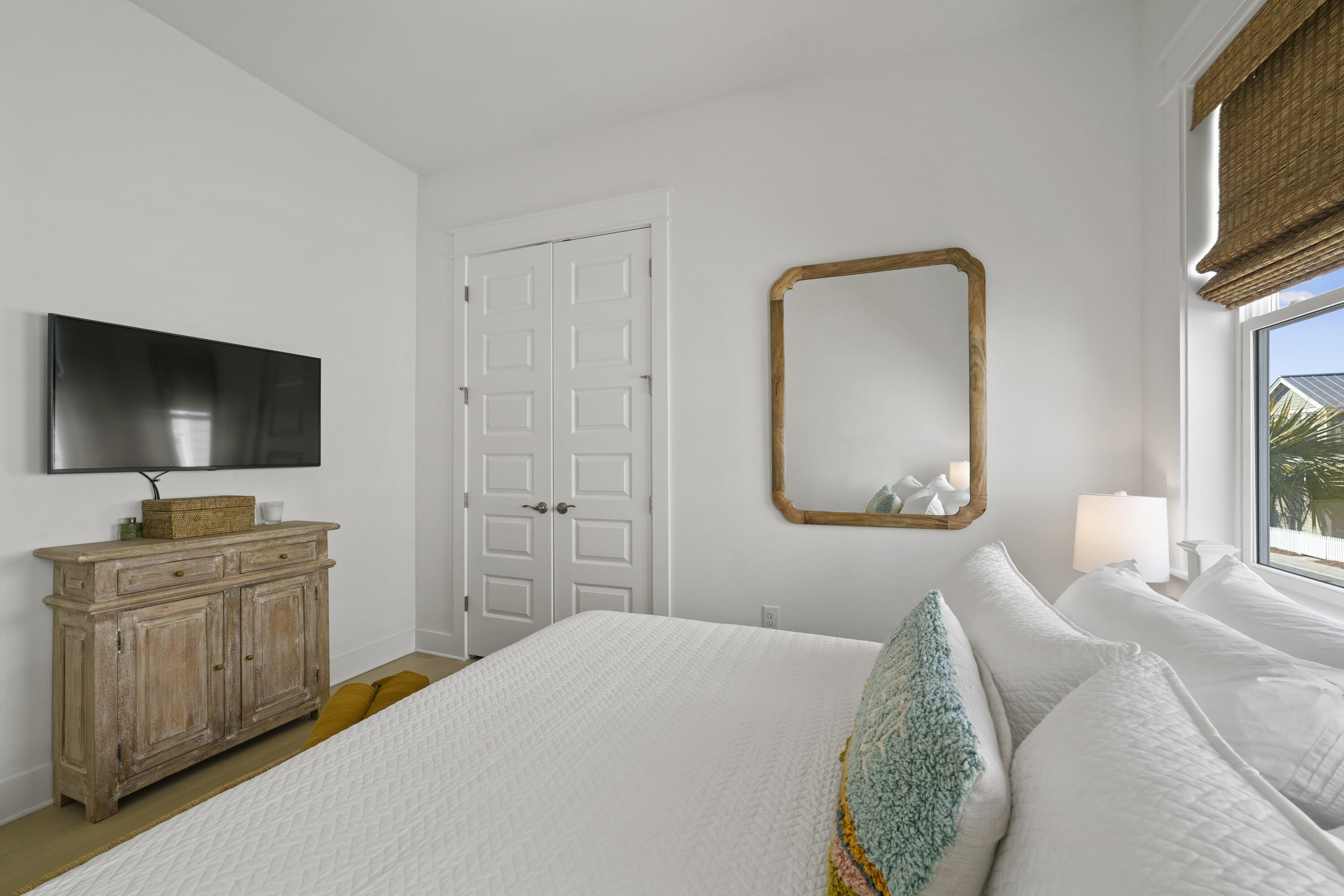 96 Wharf Ln Inlet Beach, Unit B Inlet Beach, FL 32461 - Photo 24 of 44 a bedroom with a bed and a flat screen tv