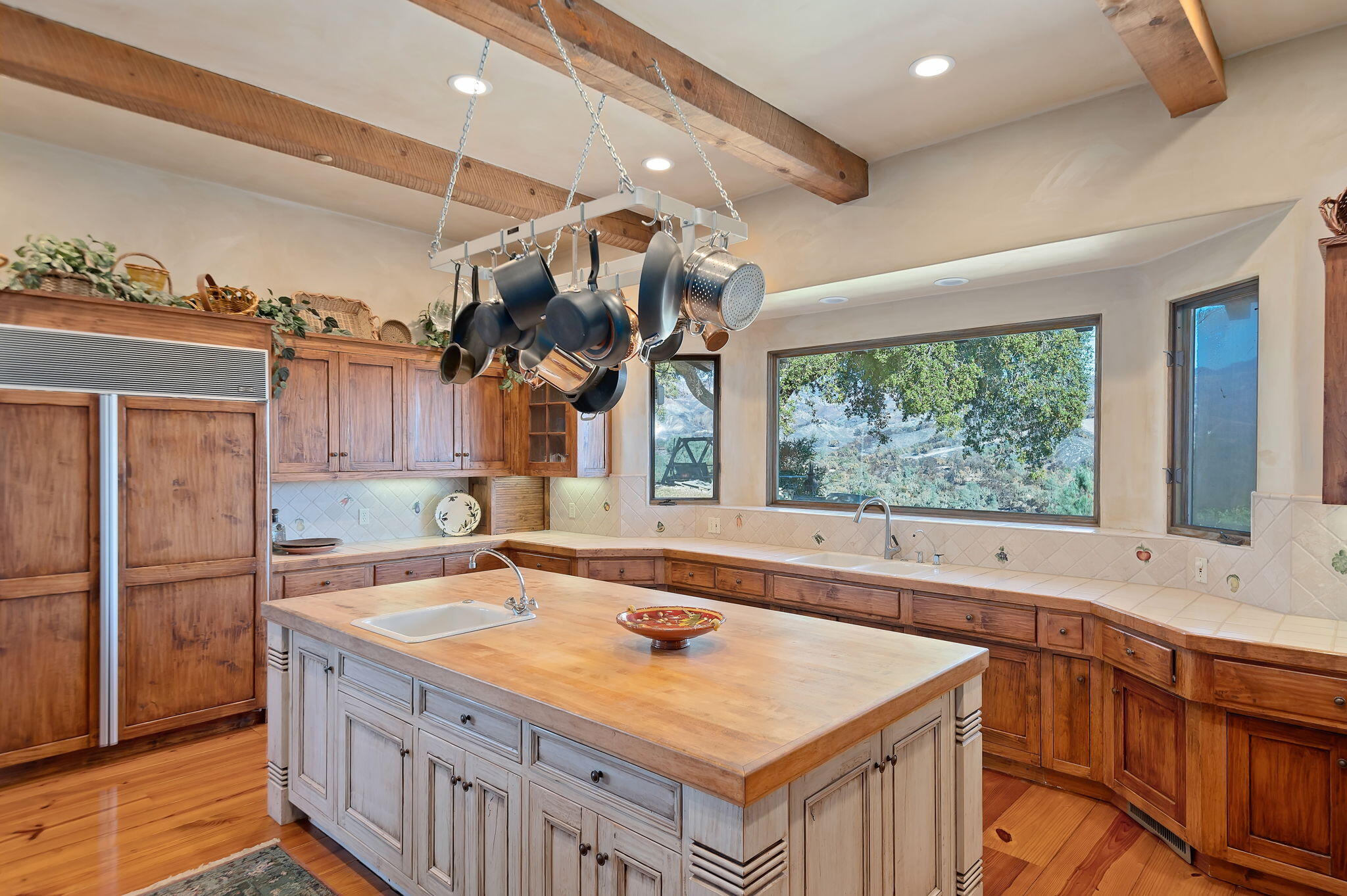 4600 Tim's Road Santa Ynez, CA 93460 - Photo 12 of 47 a kitchen with a stove a sink and a refrigerator