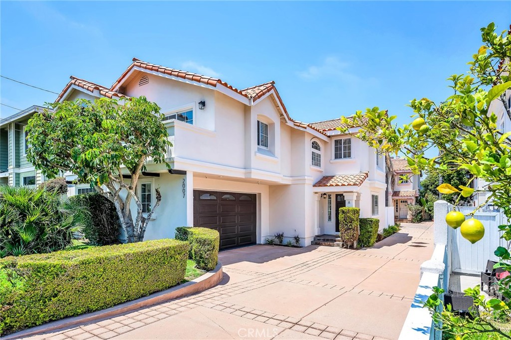 2007 Gates Avenue, Unit A Redondo Beach, CA 90278 - Photo 1 of 29 a front view of a house with a garden and mountain view