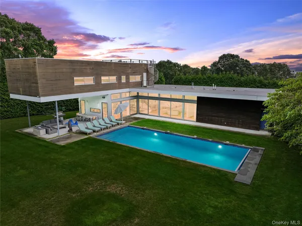 a view of a swimming pool with a patio