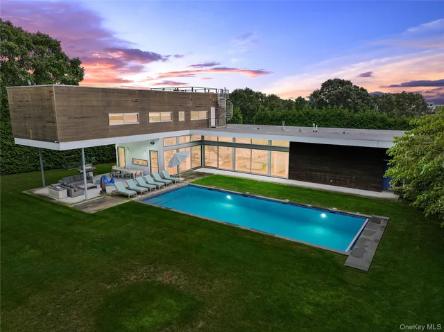 a view of a swimming pool with a patio