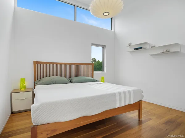 a bedroom with a bed and a table