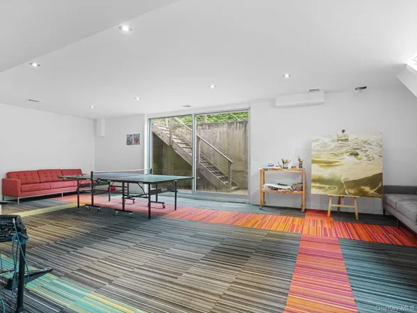 a living room with furniture a rug and a wooden floor