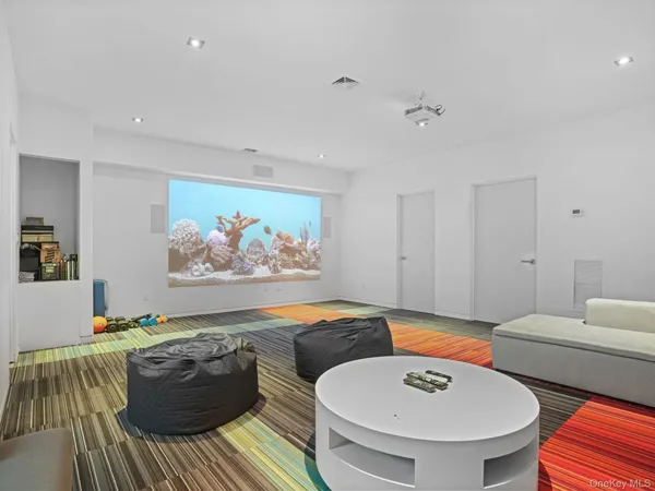 a living room with furniture and a pool