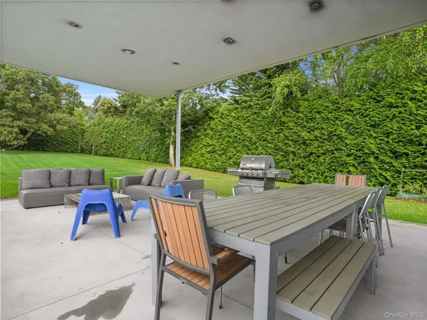an outdoor space with furniture and garden view