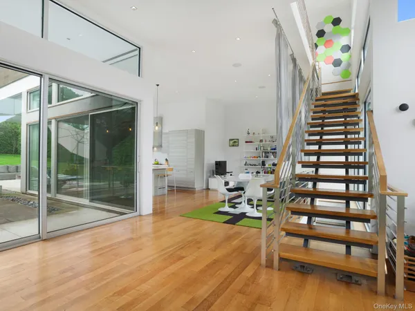 a view of entryway with wooden floor and stairs