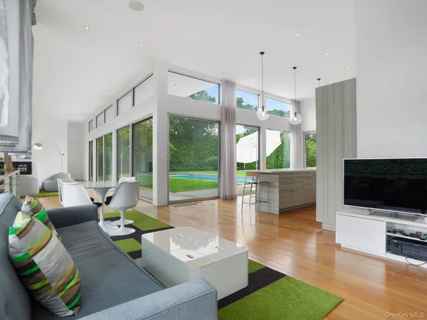 a living room with fireplace furniture and a flat screen tv