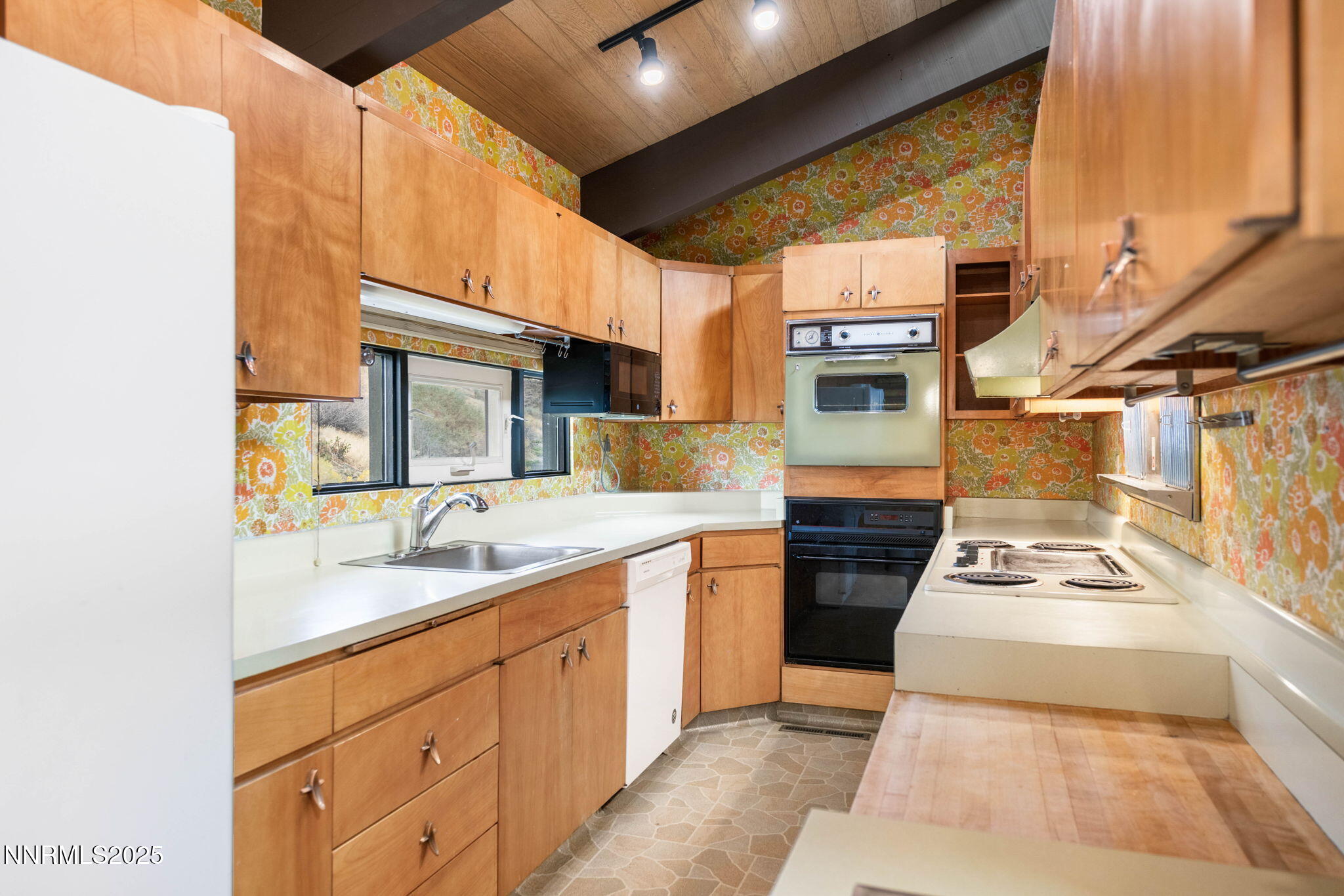 77 Ophir Mill Road Dayton, NV 89403 - Photo 11 of 44 a kitchen with sink cabinets and stove