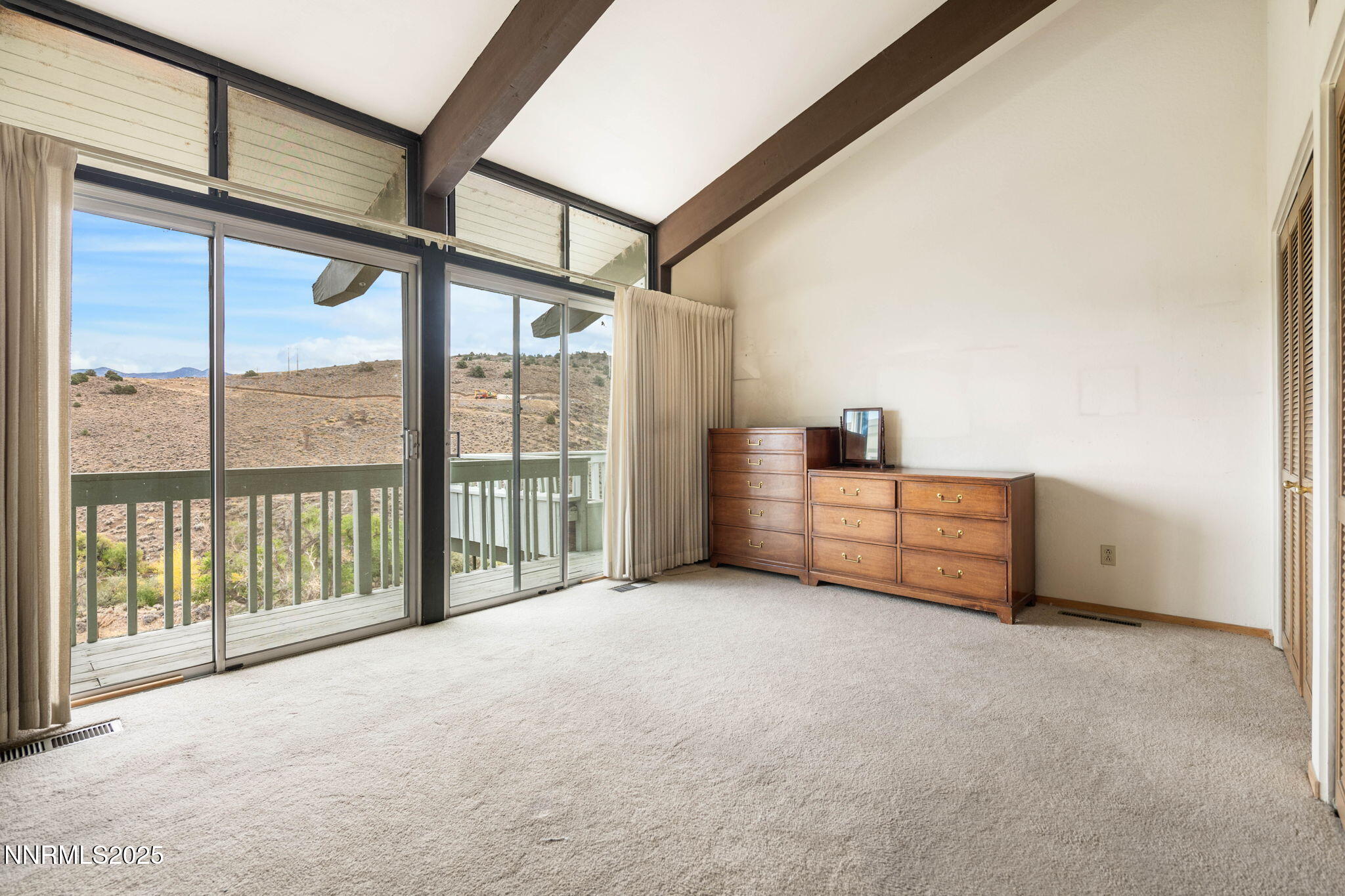 77 Ophir Mill Road Dayton, NV 89403 - Photo 15 of 44 a view of an empty room with windows