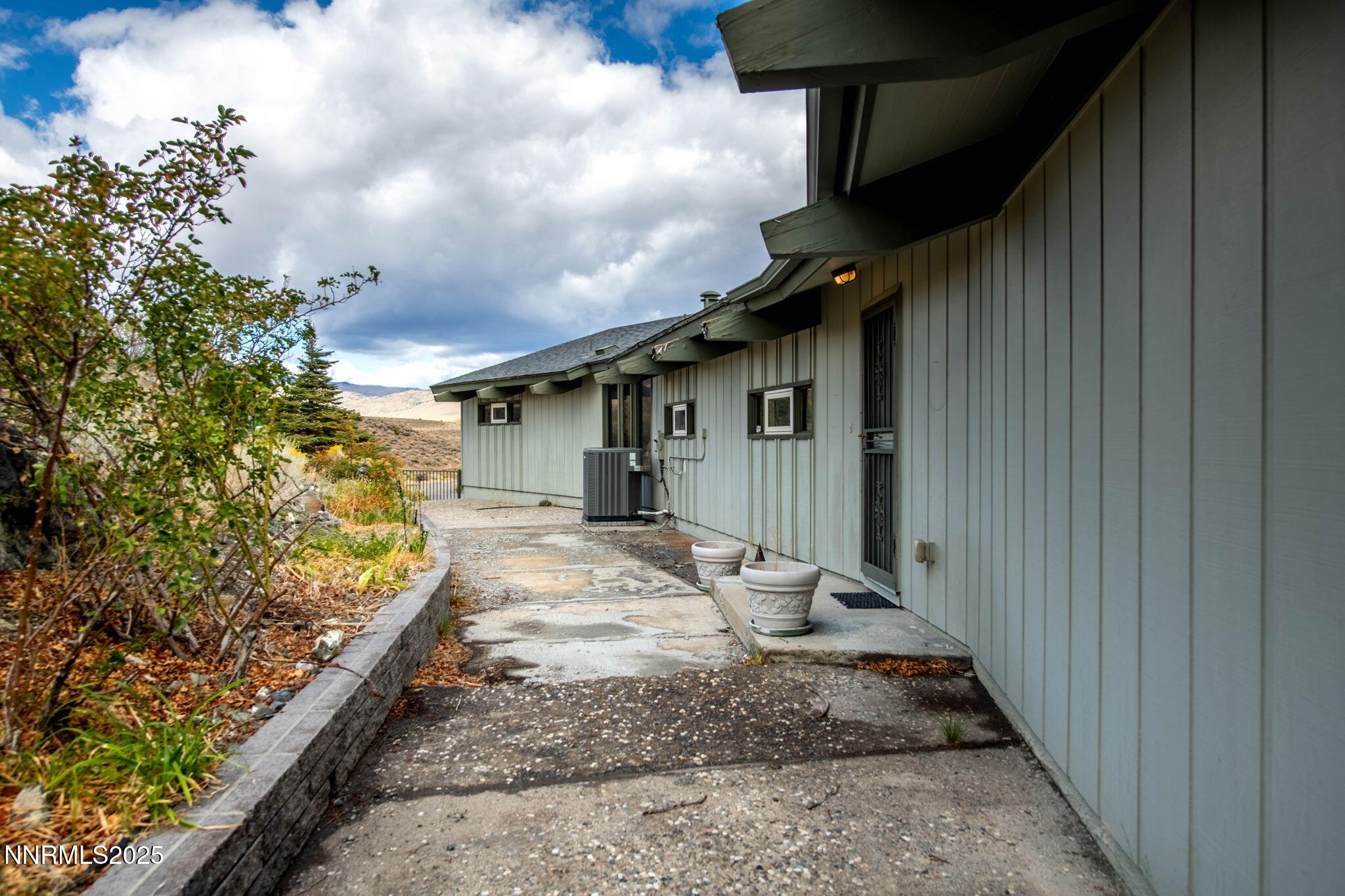 77 Ophir Mill Road Dayton, NV 89403 - Photo 27 of 44 a front view of a house with garden