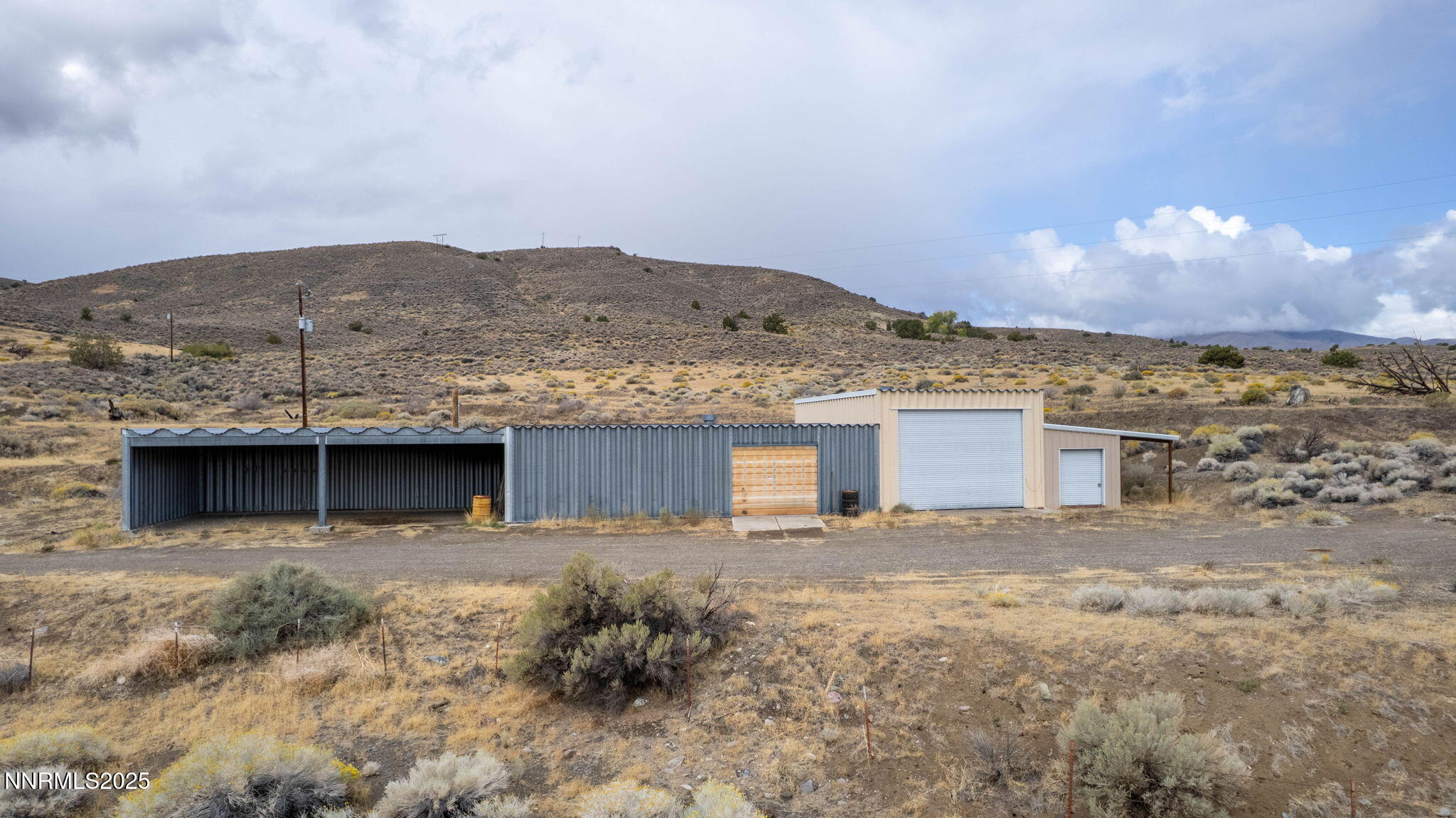 77 Ophir Mill Road Dayton, NV 89403 - Photo 30 of 44 a view of a house with a yard and a large window