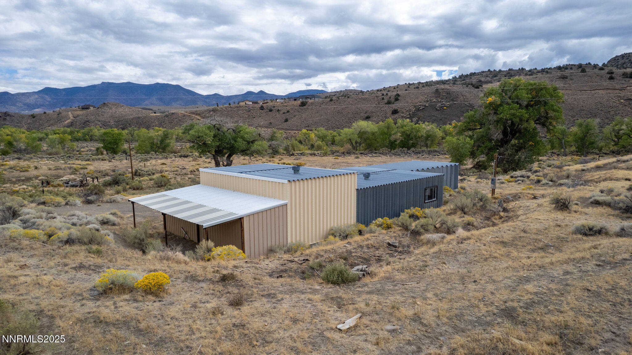 77 Ophir Mill Road Dayton, NV 89403 - Photo 31 of 44 a view of a backyard with a garden and mountain view
