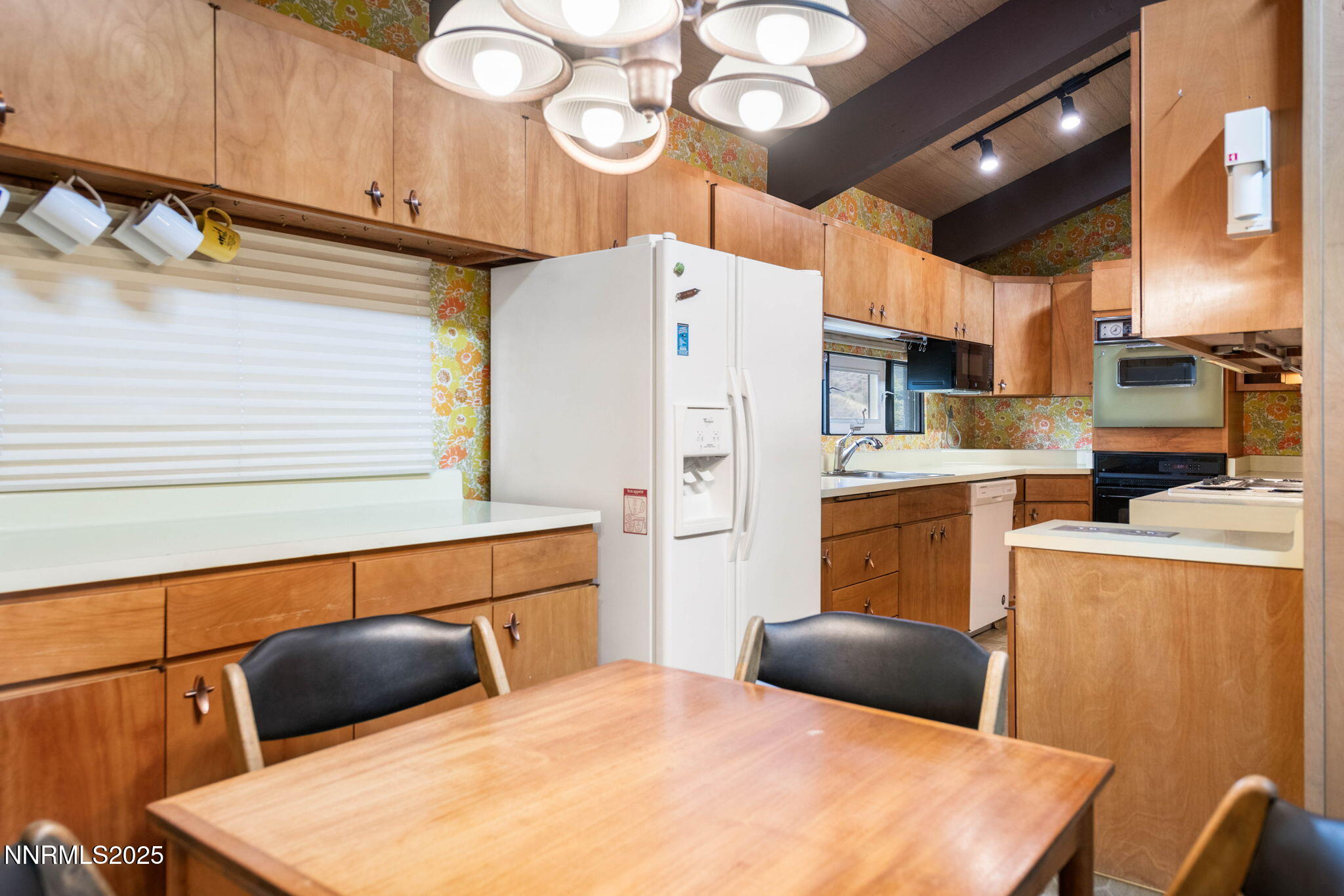 77 Ophir Mill Road Dayton, NV 89403 - Photo 39 of 44 a kitchen with stainless steel appliances a stove a refrigerator a sink and white cabinets