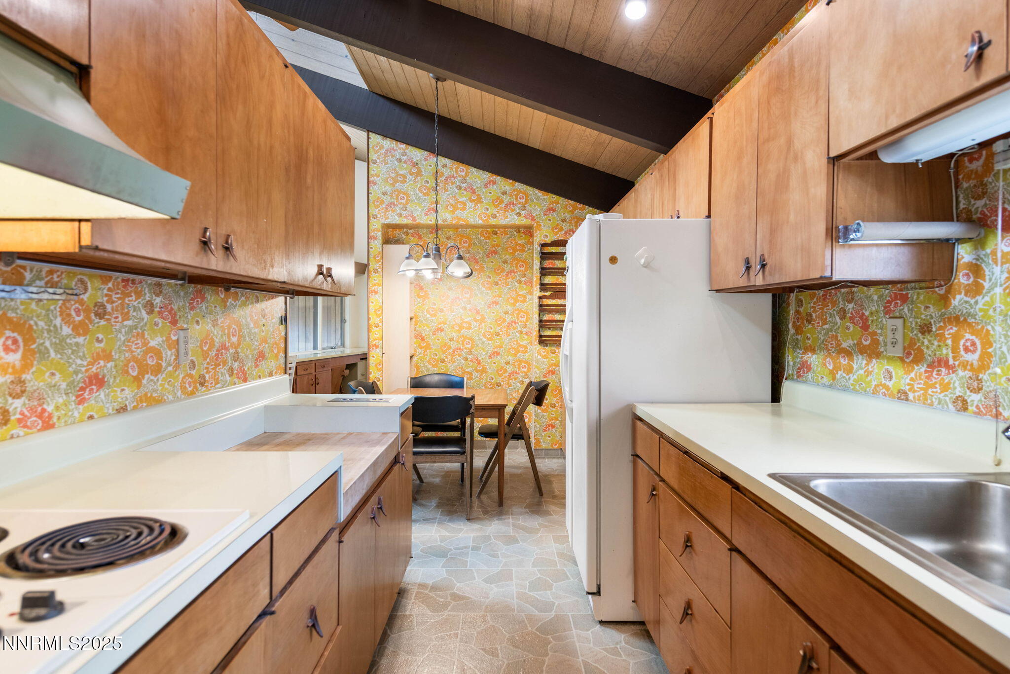 77 Ophir Mill Road Dayton, NV 89403 - Photo 40 of 44 a kitchen with a sink a stove and a refrigerator