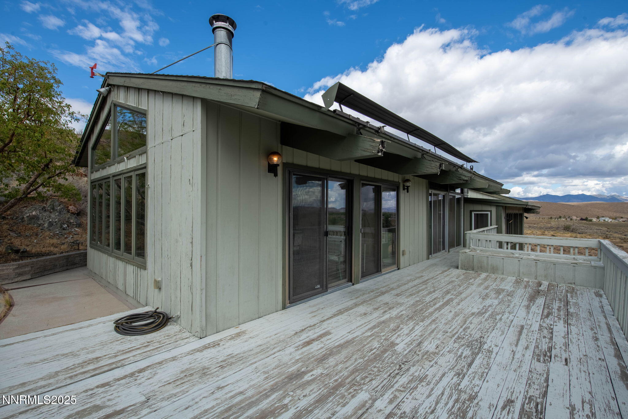 77 Ophir Mill Road Dayton, NV 89403 - Photo 7 of 44 a view of a house with wooden fence