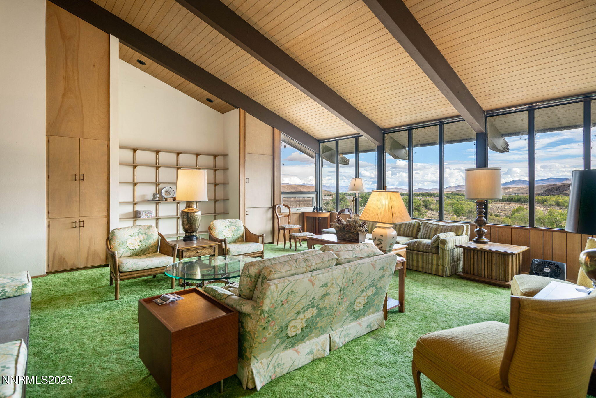 77 Ophir Mill Road Dayton, NV 89403 - Photo 10 of 44 a living room with patio furniture and a garden