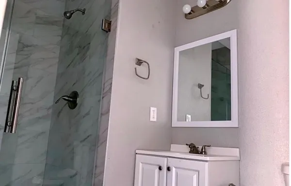 a bathroom with a sink and a mirror