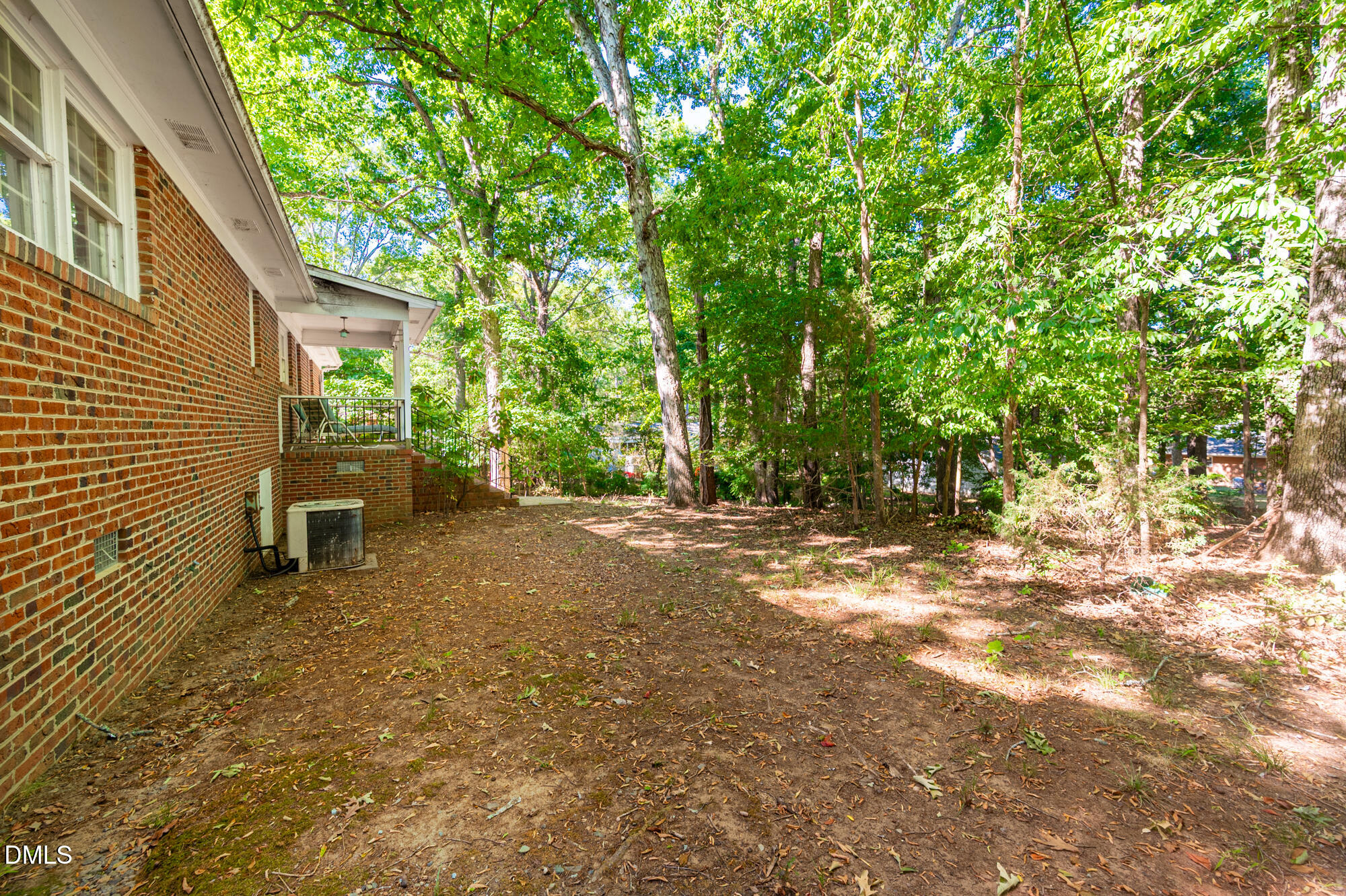 4411 Rhew Drive Durham, NC 27704 - Photo 31 of 34 a view of a backyard with a tree