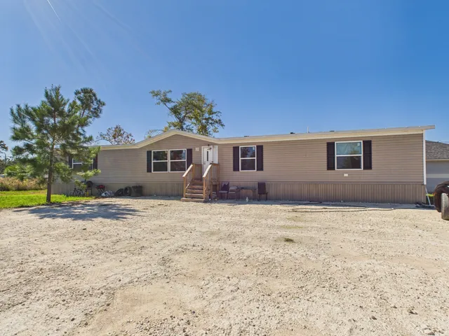 a house with yard in front of it