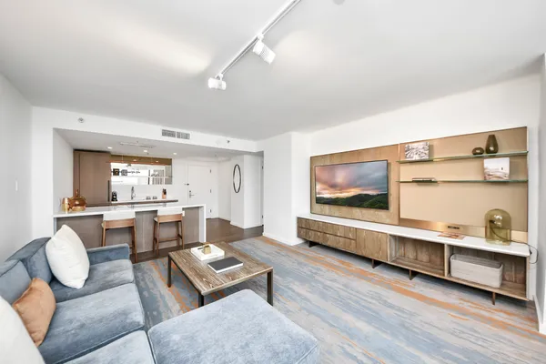 a dining room with furniture and a window