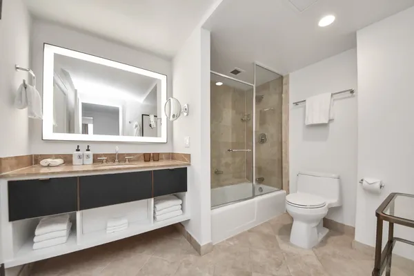 a kitchen with a sink and a mirror