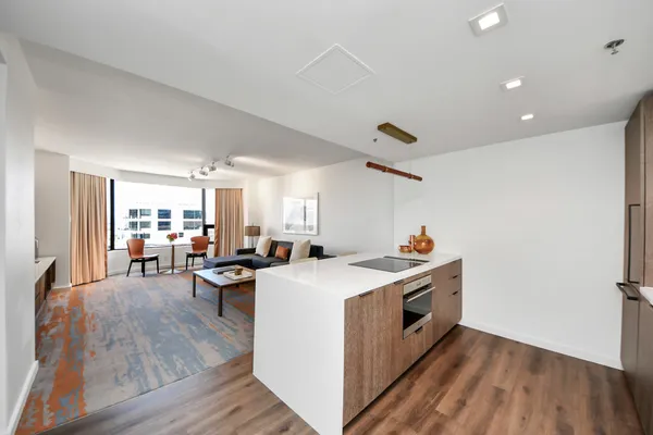 a view of a kitchen counter space and wooden floor
