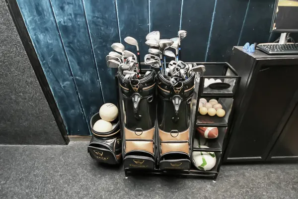 a room with stainless steel appliances furniture and wooden floor