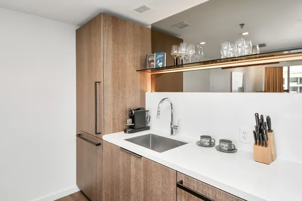 a kitchen with a sink and a refrigerator