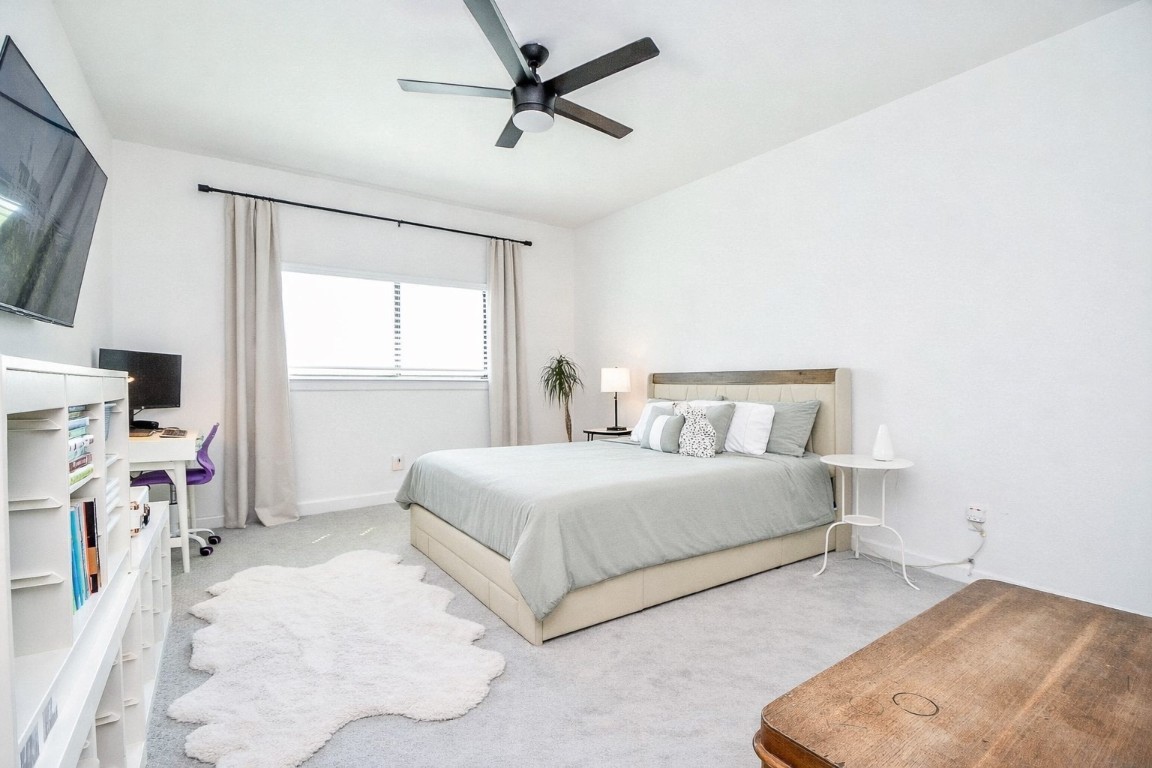 5315 Jason Street Houston, TX 77096 - Photo 25 of 39 a bedroom with a bed and a flat tv screen