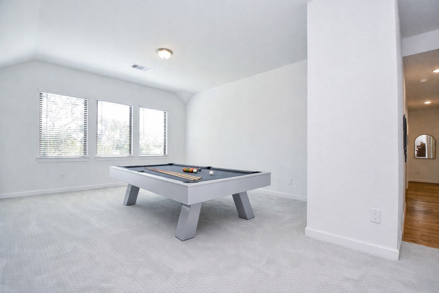 5315 Jason Street Houston, TX 77096 - Photo 28 of 39 Enjoy family time in the elevated game room, a versatile space perfect for games, movies, and gathering. Virtually staged.