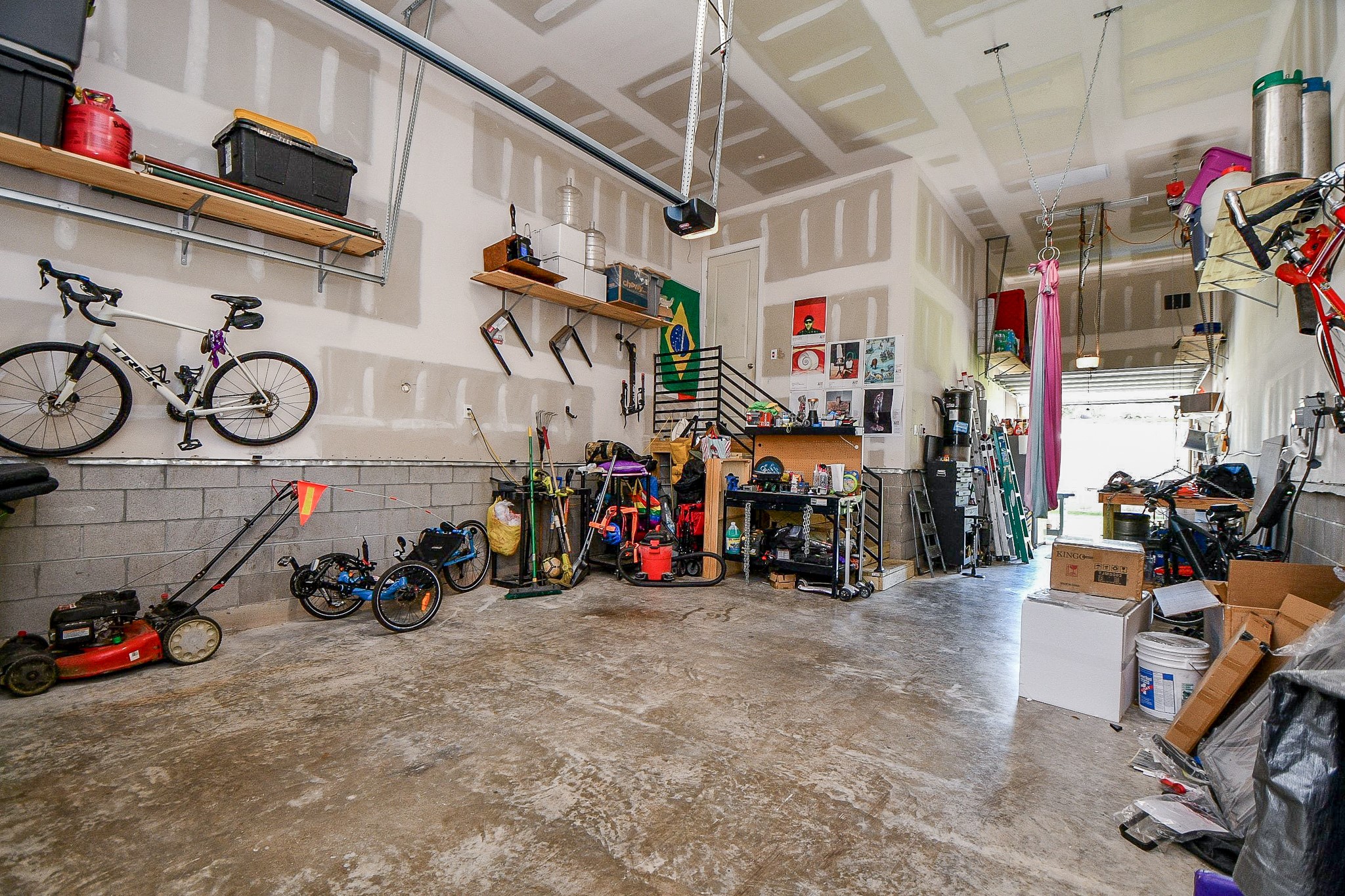 5315 Jason Street Houston, TX 77096 - Photo 29 of 39 A spacious two-story garage includes an EV charging station, blending functionality with forward-thinking design.