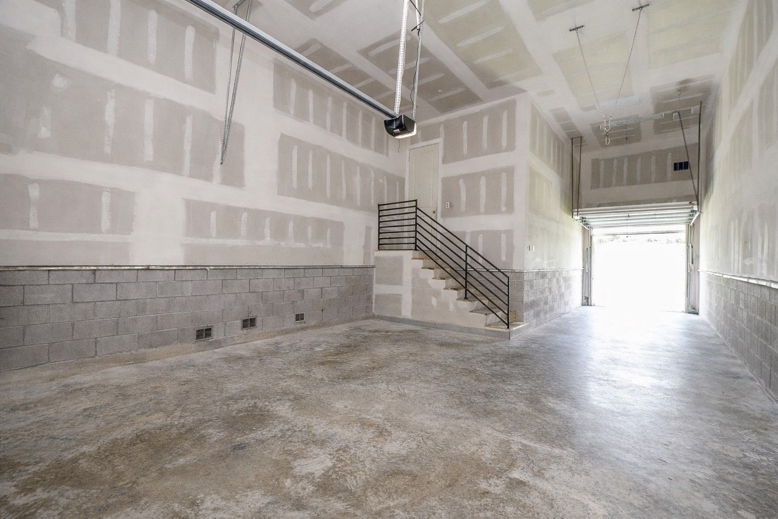 5315 Jason Street Houston, TX 77096 - Photo 30 of 39 Virtually enhanced image. The tandem garage features a rear roll-up door, offering seamless access to the pool and outdoor space.