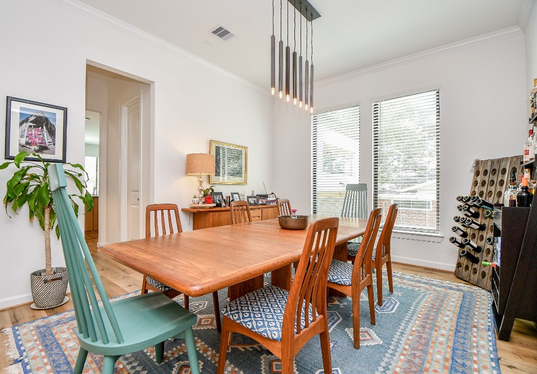 5315 Jason Street Houston, TX 77096 - Photo 3 of 39 a view of a dining room with furniture window and wooden floor