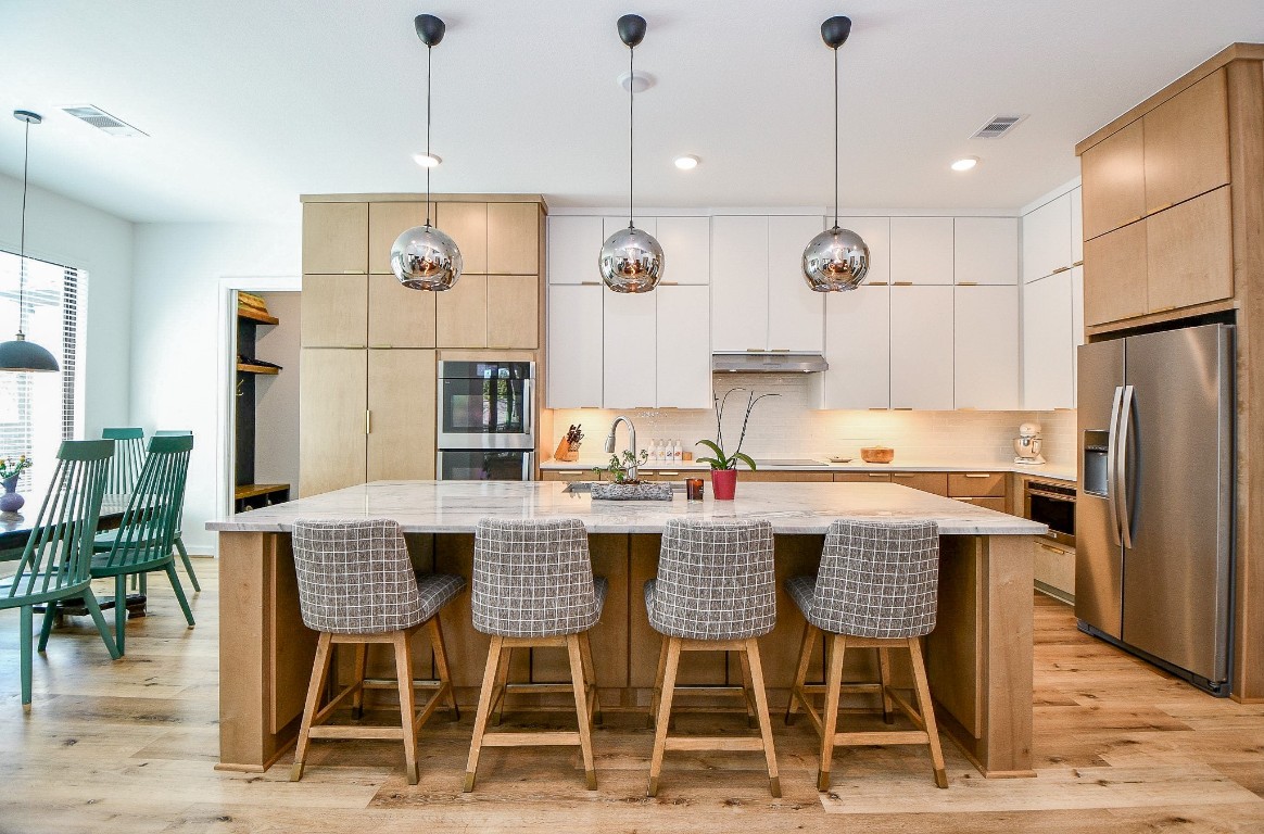 5315 Jason Street Houston, TX 77096 - Photo 6 of 39 a dining table with chairs and kitchen view