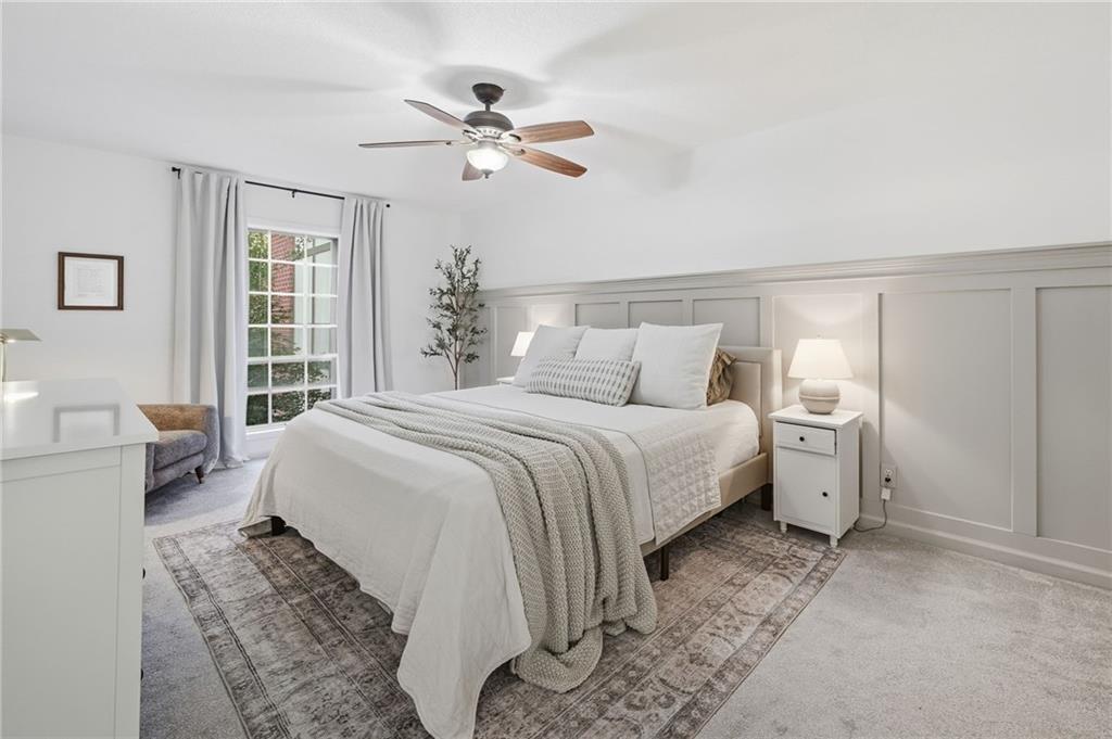 6851 Roswell Road, Unit H29 Atlanta, GA 30328 - Photo 16 of 50 a bedroom with a white bed and white walls