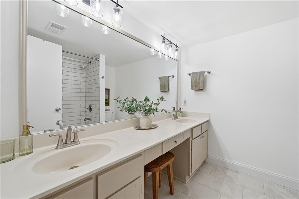 6851 Roswell Road, Unit H29 Atlanta, GA 30328 - Photo 20 of 50 a bathroom with a sink and a mirror