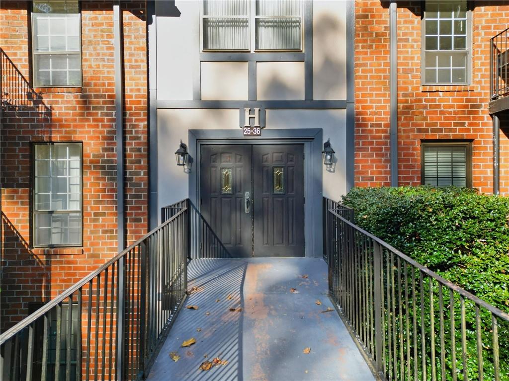 6851 Roswell Road, Unit H29 Atlanta, GA 30328 - Photo 2 of 50 a view of a balcony with a potted plant