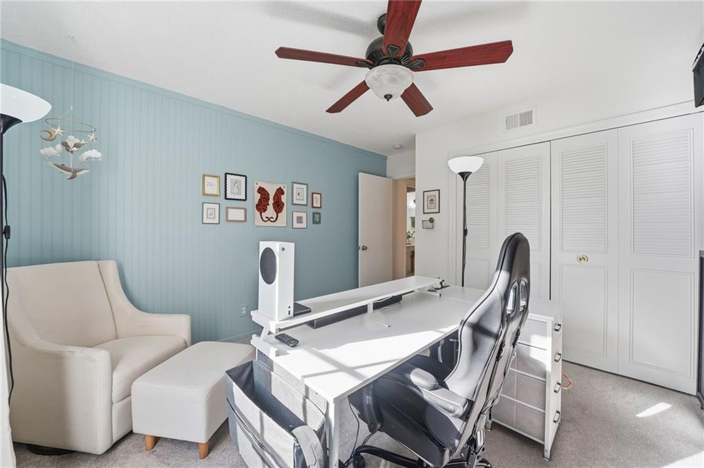 6851 Roswell Road, Unit H29 Atlanta, GA 30328 - Photo 23 of 50 a view of a dining room with furniture and a chandelier